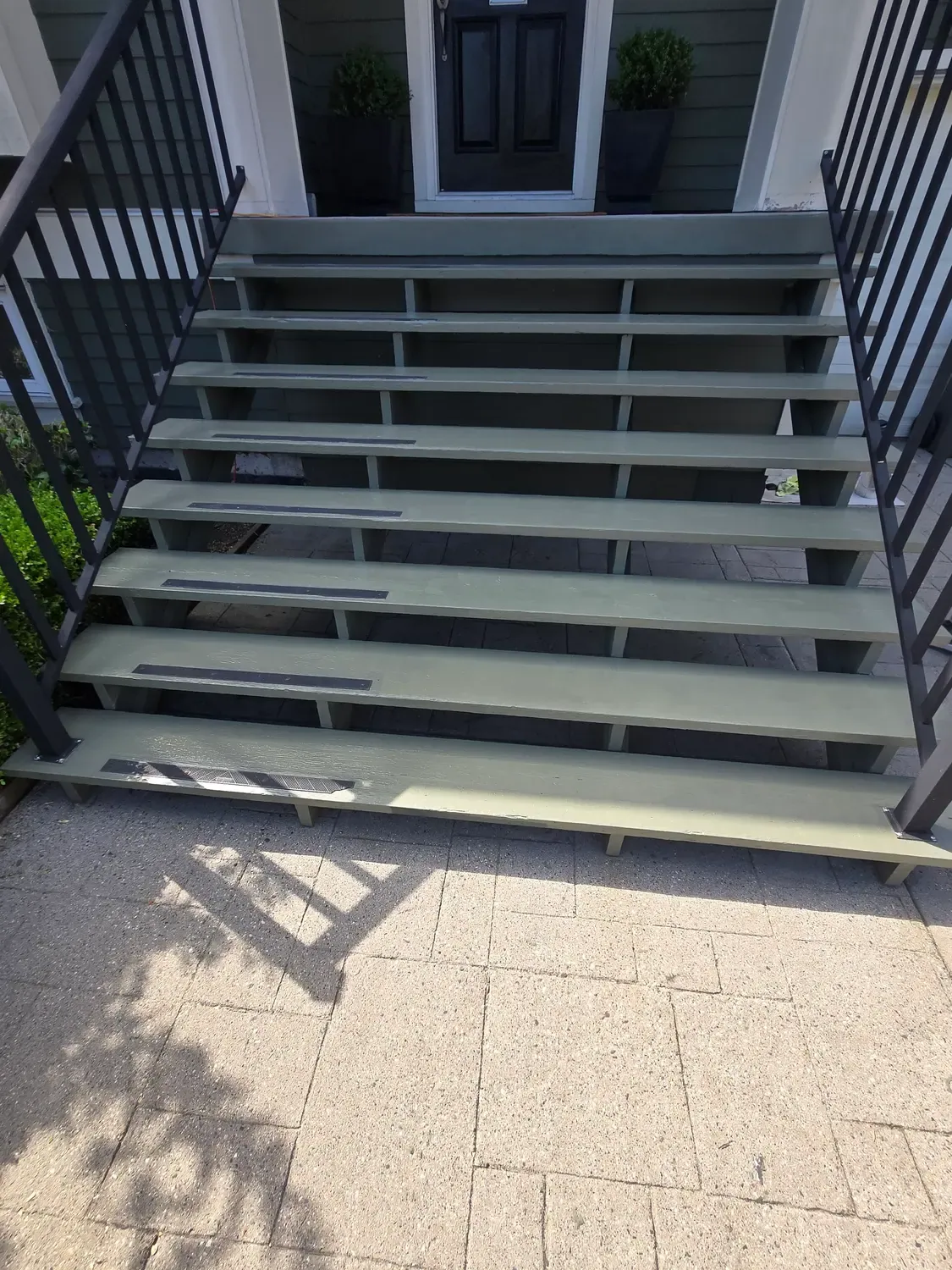 The same front steps after being stripped and recoated
