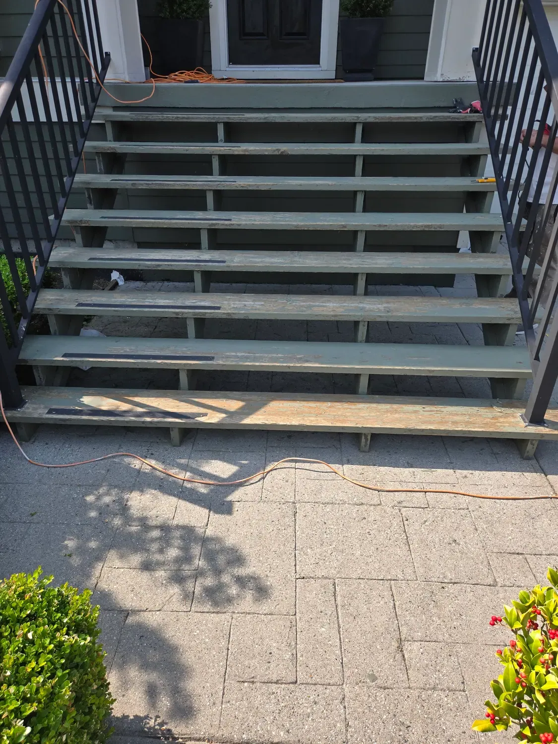 Front steps before painting, with worn and peeling treads